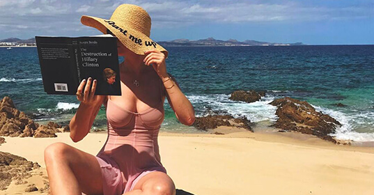 Katy Perry’s beach read is a book about Hillary Clinton’s campaign